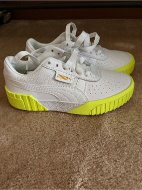 Puma women’s White Sneakers with Neon Yellow Sole Accent